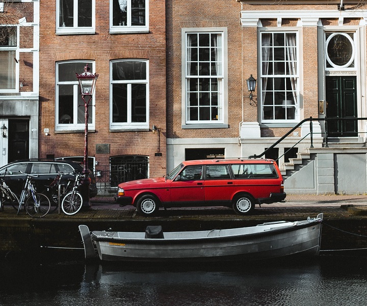 small boat moored in a city canal setting