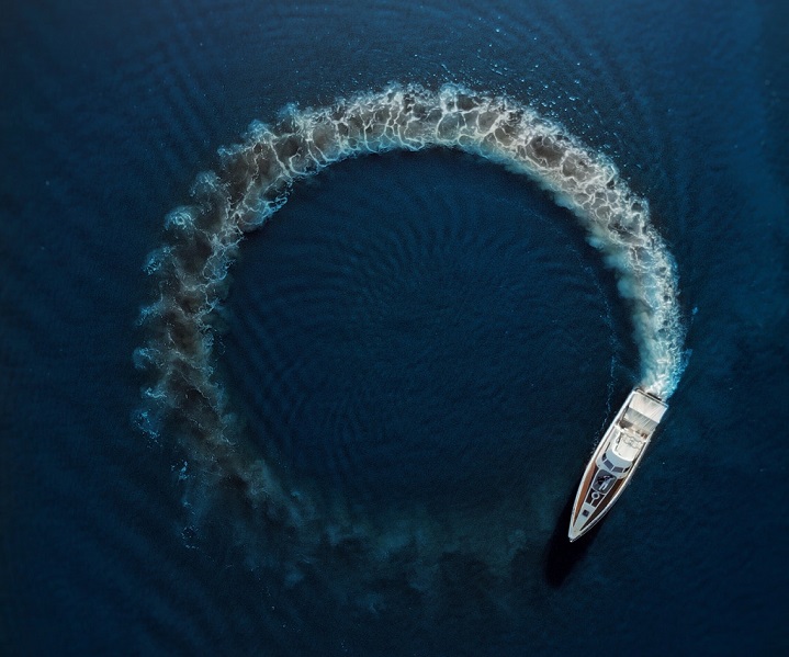 aerial view of a speedboat performing a doughnut